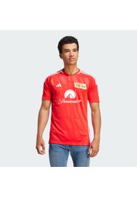 Adidas - Koszulka 1. FC Union Berlin 23/24 Home Jersey. Kolor: czerwony, wielokolorowy, biały, różowy. Materiał: jersey #1