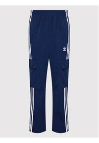 Adidas - adidas Spodnie dresowe adicolor 3-Stripes Cargo HN6735 Granatowy Relaxed Fit. Kolor: niebieski. Materiał: syntetyk, dresówka #4