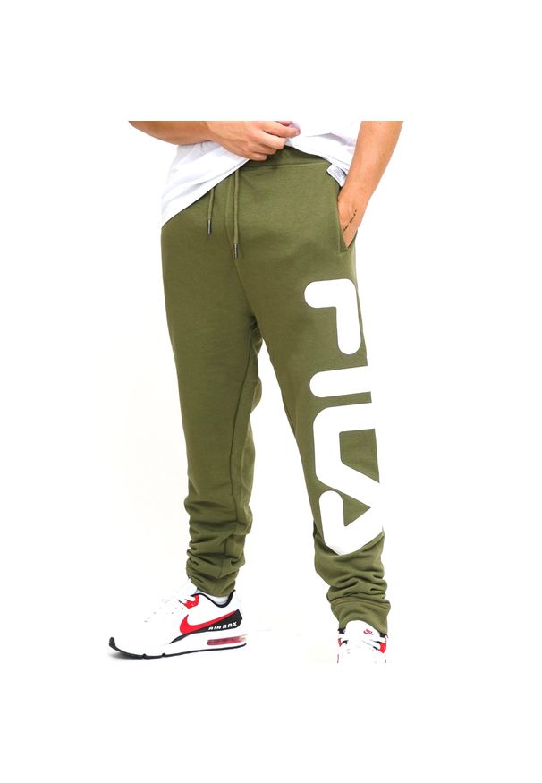 Jogging Fila Bronte. Kolor: zielony. Materiał: poliester, bawełna. Sport: bieganie