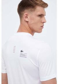 Lacoste t-shirt męski kolor biały gładki. Kolor: biały. Długość rękawa: krótki rękaw. Długość: krótkie. Wzór: gładki. Styl: klasyczny #2