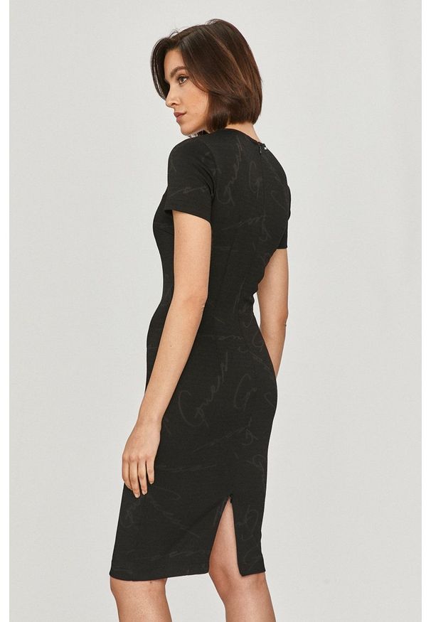 Guess - Sukienka. Kolor: czarny. Materiał: dzianina. Długość rękawa: krótki rękaw. Typ sukienki: dopasowane