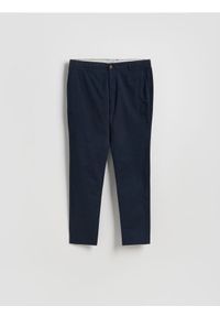 Reserved - Spodnie chino slim fit - granatowy. Kolor: niebieski. Materiał: tkanina, bawełna