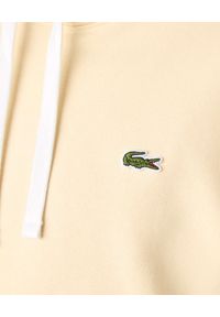 Lacoste - LACOSTE - Beżowa bluza z kapturem Unisex Fit. Typ kołnierza: kaptur. Kolor: beżowy. Materiał: bawełna, dresówka, prążkowany, polar, jeans. Wzór: aplikacja #7