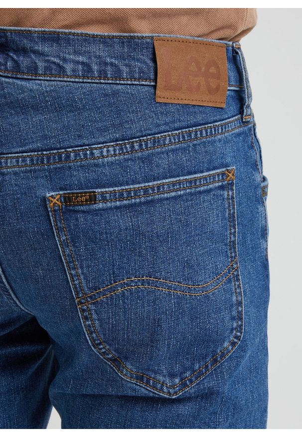 Lee - LEE DAREN ZIP FLY MĘSKIE SPODNIE JEANSOWE STONEAGE MID L707KND14 112338472