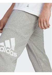 Adidas - adidas Spodnie dresowe Essentials HA4345 Szary Regular Fit. Kolor: szary. Materiał: bawełna