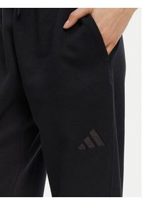 Adidas - adidas Spodnie dresowe ALL SZN Fleece IW1024 Czarny Loose Fit. Kolor: czarny. Materiał: bawełna #3