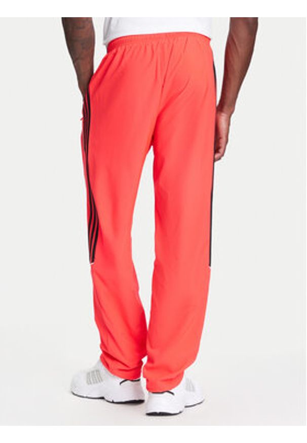 Adidas - adidas Spodnie dresowe Teamgeist adicolor JW5871 Czerwony Loose Fit. Kolor: czerwony. Materiał: syntetyk