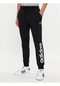 Adidas - adidas Spodnie dresowe Essentials French Terry Tapered Cuff Logo Joggers IC0063 Czarny Regular Fit. Kolor: czarny. Materiał: bawełna