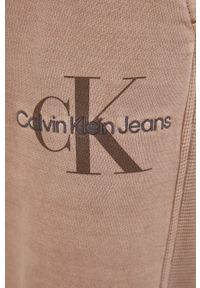 Calvin Klein Jeans spodnie dresowe bawełniane kolor brązowy gładkie. Kolor: brązowy. Materiał: bawełna, dresówka. Wzór: gładki #2