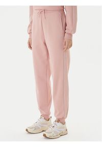 Guess Spodnie dresowe V5BB23 KCX22 Różowy Regular Fit. Kolor: różowy. Materiał: syntetyk #1