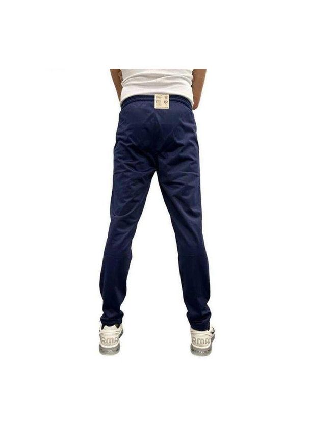 Puma - Spodnie Do Joggingu Męskie Logo. Kolor: niebieski. Materiał: dresówka. Sport: bieganie