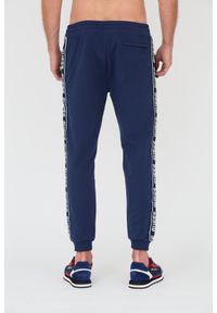 Guess - GUESS Granatowe spodnie. Kolor: niebieski. Materiał: dresówka #3