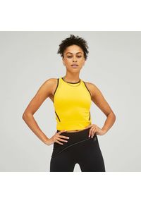 Koszulka New Balance WT21297VAC – żółta. Kolor: żółty. Materiał: materiał. Długość rękawa: bez rękawów. Sport: fitness