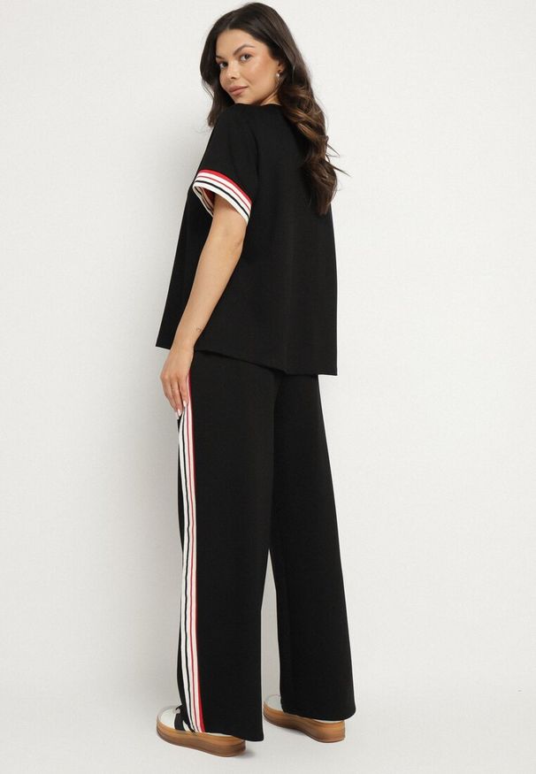 Born2be - Czarny Komplet z Wiskozą Szerokie Spodnie i Bluzka z Paskami Nilanaria. Kolor: czarny. Materiał: wiskoza