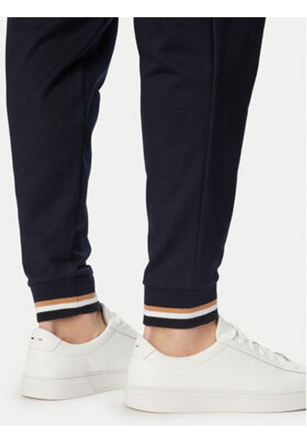 BOSS Spodnie dresowe Iconic 50554830 Granatowy Regular Fit. Kolor: niebieski. Materiał: bawełna