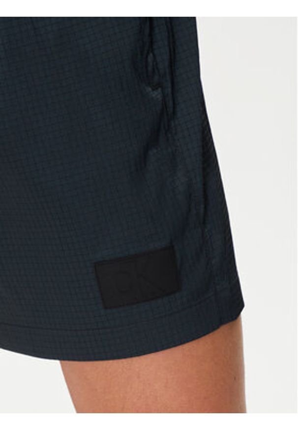 Calvin Klein Swimwear Szorty kąpielowe KM0KM01023 Czarny Regular Fit. Kolor: czarny. Materiał: syntetyk