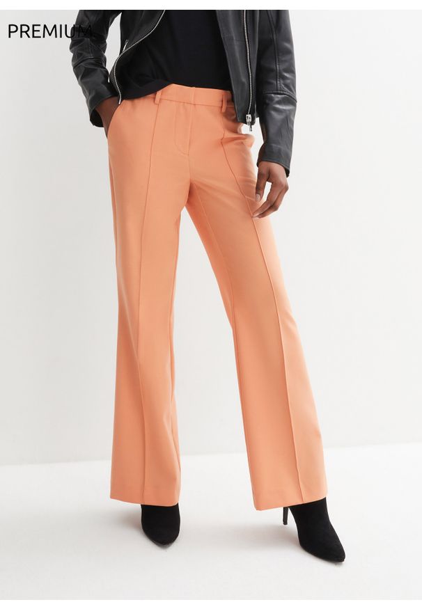 bonprix - Spodnie wełniane z chłodzącej wełny. Kolor: pomarańczowy. Materiał: wełna