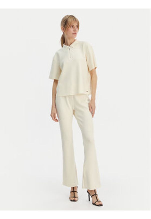 Calvin Klein Spodnie materiałowe LV044B223G Beżowy Flare Fit. Kolor: beżowy. Materiał: syntetyk