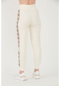 Guess - GUESS Beżowe damskie spodnie dresowe Britney Jogger, Rozmiar XL. Kolor: beżowy. Materiał: dresówka