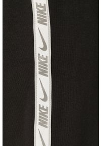 Nike Sportswear - Spodnie. Kolor: czarny. Materiał: bawełna, poliester, dzianina. Wzór: aplikacja #4