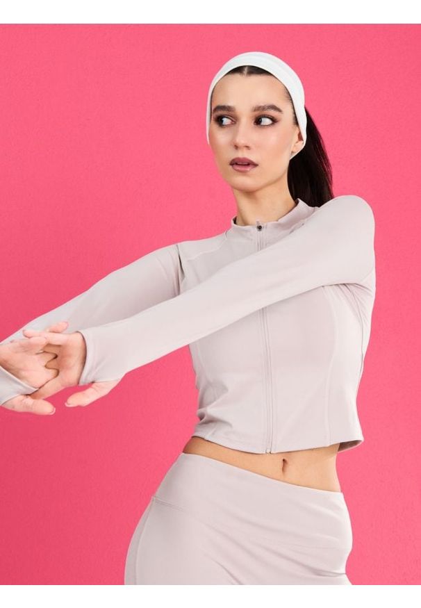 Sinsay - Rozpinana sportowa bluza ze stójką i otworami na kciuki Gym Hard - kremowy. Typ kołnierza: kołnierzyk stójkowy. Kolor: kremowy