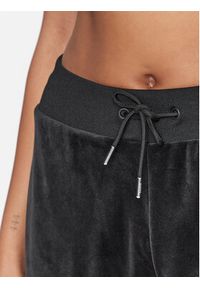 Guess Spodnie dresowe V3BB27 KBXI2 Czarny Regular Fit. Kolor: czarny. Materiał: syntetyk