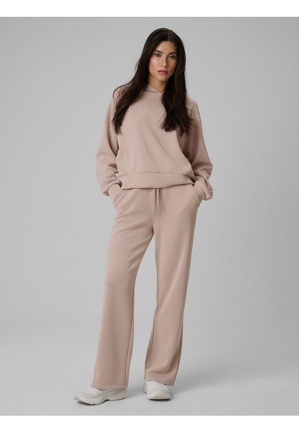 4f - 4F Spodnie dresowe z modalem damskie - beżowe L. Stan: podwyższony. Kolor: beżowy. Materiał: dresówka. Długość: do kostek. Wzór: gładki