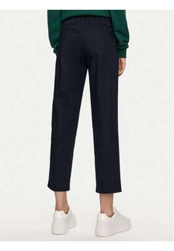 TOMMY HILFIGER - Tommy Hilfiger Chinosy Travel WW0WW43632 Granatowy Slim Fit. Kolor: niebieski. Materiał: bawełna