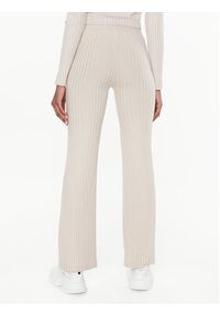 Calvin Klein Jeans Spodnie materiałowe J20J220678 Beżowy Flare Fit. Kolor: beżowy. Materiał: wiskoza, materiał