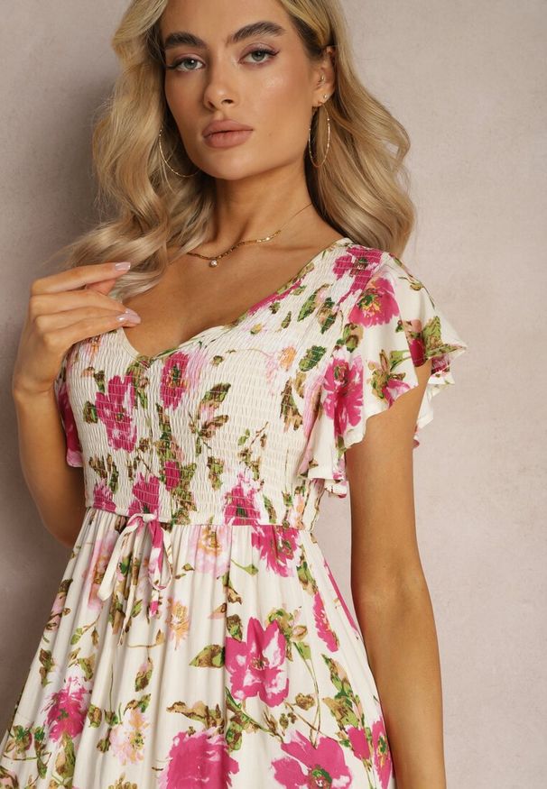 Renee - Jasnobeżowa Wiskozowa Sukienka w Kwiatowy Print Rozkloszowana Maxi Veradisia. Okazja: na plażę, na spacer. Kolor: beżowy. Materiał: wiskoza. Wzór: kwiaty, nadruk. Sezon: lato. Długość: maxi