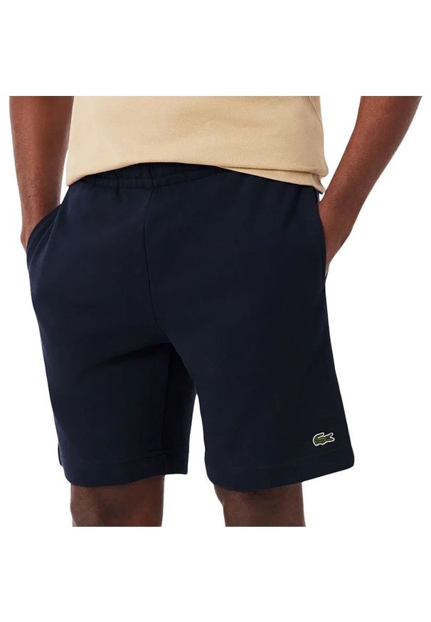 Spodenki męskie Lacoste GH9860-166 - granatowe. Kolor: niebieski. Materiał: bawełna. Długość: do kolan. Sport: fitness