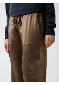 Guess Spodnie materiałowe 172809 Brązowy Slim Fit. Kolor: brązowy. Materiał: materiał #4