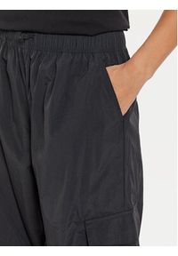 New Balance Spodnie dresowe WP43534 Czarny Relaxed Fit. Kolor: czarny. Materiał: syntetyk #5