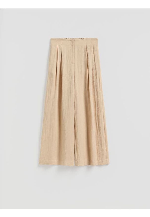 Reserved - Spodnie z lyocellem - beżowy. Kolor: beżowy. Materiał: wiskoza, tkanina