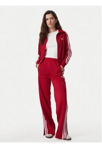 Adidas - adidas Spodnie dresowe Firebird Loose Tracksuit KS4670 Czerwony Loose Fit. Kolor: czerwony. Materiał: syntetyk #5