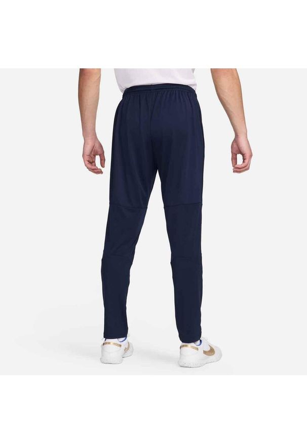 Nike - Spodnie sportowe męskie Dri-FIT Park 20 Knit Pants. Kolor: niebieski, wielokolorowy, biały. Materiał: poliester. Technologia: Dri-Fit (Nike). Sport: piłka nożna