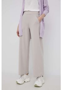 JDY spodnie damskie kolor beżowy szerokie high waist. Stan: podwyższony. Kolor: beżowy. Materiał: dzianina