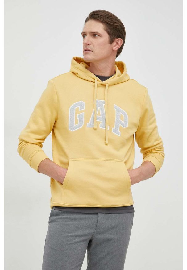 GAP bluza męska kolor żółty z kapturem z aplikacją. Typ kołnierza: kaptur. Kolor: żółty. Materiał: poliester. Wzór: aplikacja