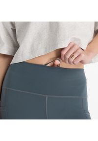 Legginsy damskie do biegania New Balance Sleek WP51268GT – szare. Stan: podwyższony. Kolor: szary. Materiał: lycra, poliester, materiał. Wzór: gładki. Sport: fitness #4