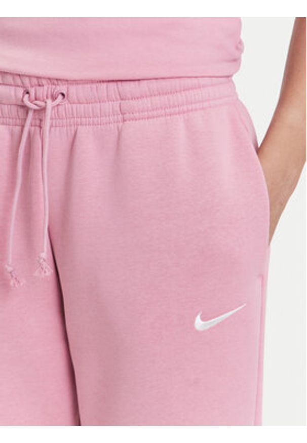 Nike Spodnie dresowe Sportswear Phoenix Fleece FZ7626 Różowy Regular Fit. Kolor: różowy. Materiał: bawełna