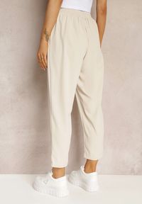 Renee - Beżowe Spodnie High Waist z Gumką i Troczkiem w Pasie oraz Kieszeniami Arlettia. Stan: podwyższony. Kolor: beżowy. Materiał: tkanina. Długość: długie. Wzór: jednolity #3