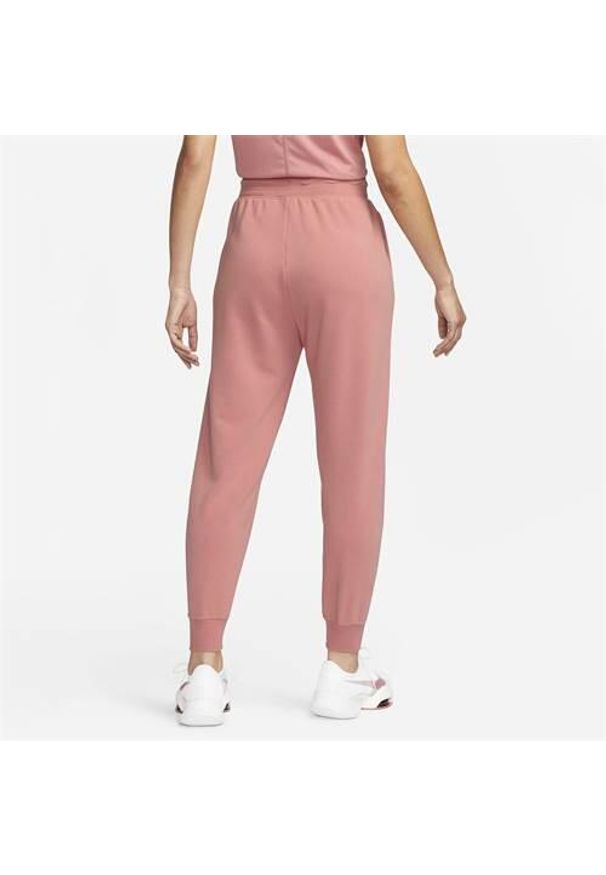 Spodnie sportowe męskie Nike FB5434618. Kolor: różowy, wielokolorowy. Materiał: dresówka. Sport: turystyka piesza