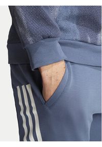 Adidas - adidas Spodnie dresowe Future Icons 3-Stripes IR9194 Niebieski Slim Fit. Kolor: niebieski. Materiał: bawełna #3