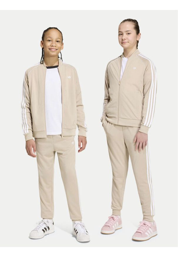 Adidas - adidas Spodnie dresowe Sst Track IA2239 Beżowy jasny Regular Fit. Kolor: beżowy. Materiał: syntetyk