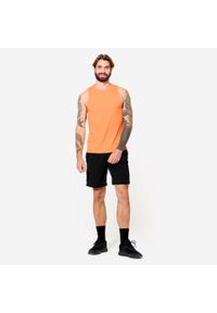 DOMYOS - Koszulka fitness męska Domyos bez rękawów. Kolor: pomarańczowy. Materiał: poliester, materiał. Długość rękawa: bez rękawów