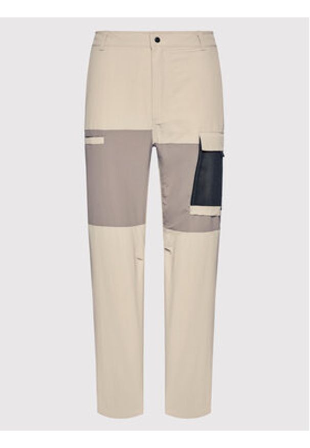 New Balance Spodnie materiałowe MP21502 Beżowy Relaxed Fit. Kolor: beżowy. Materiał: materiał, syntetyk