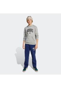 Adidas - Spodnie dziecięce ADIDAS. Kolor: niebieski. Materiał: materiał. Sport: joga i pilates