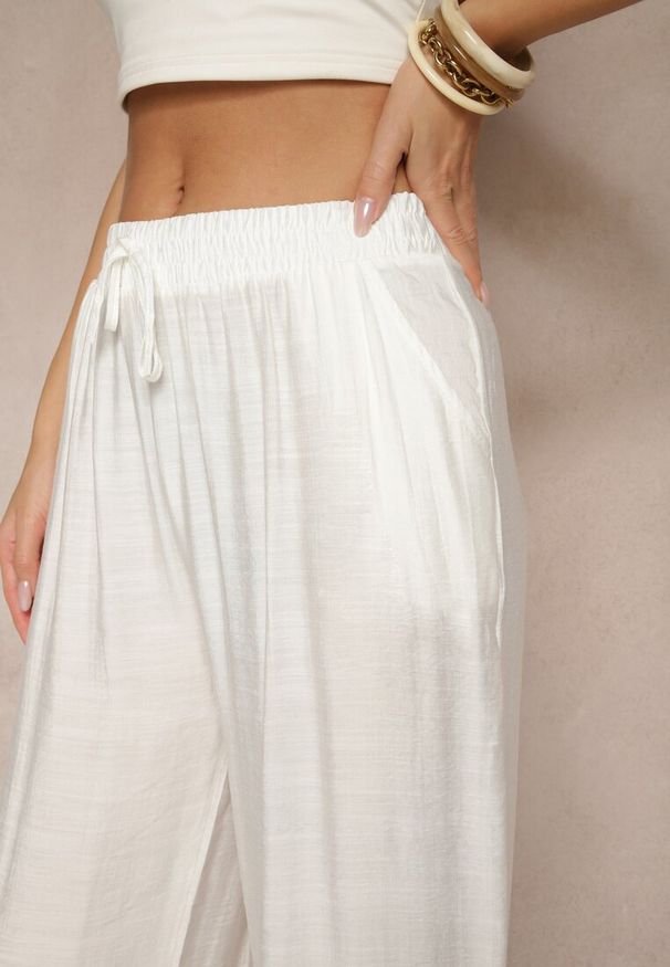 Renee - Jasnobeżowe Spodnie z Wiskozy High Waist o Szerokim Kroju Divlise. Okazja: na co dzień. Stan: podwyższony. Kolor: beżowy. Materiał: wiskoza. Styl: casual, elegancki