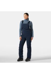 Damski kombinezon narciarski Helly Hansen Alphelia. Kolor: niebieski. Sezon: zima. Sport: narciarstwo #1