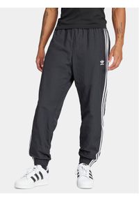 Adidas - adidas Spodnie dresowe Adicolor Woven Firebird IT2501 Czarny Regular Fit. Kolor: czarny. Materiał: syntetyk #1